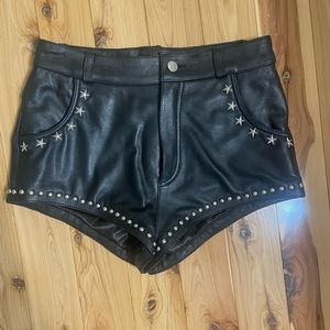 Black leather studded shorts . Size small.